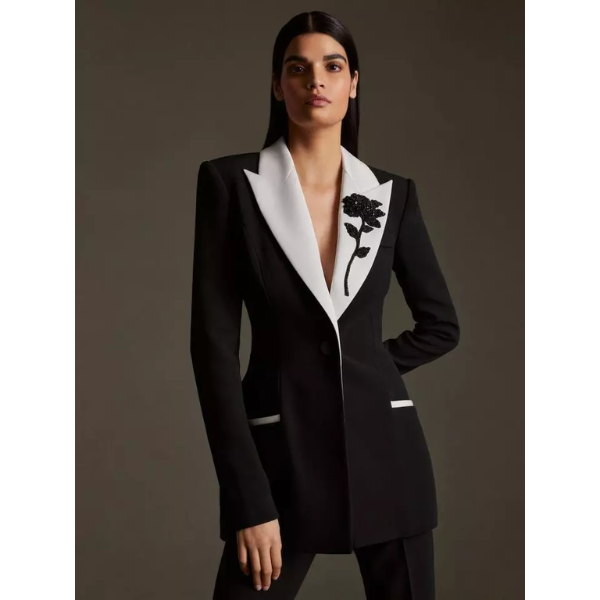 Formal black and white beaded women's suit